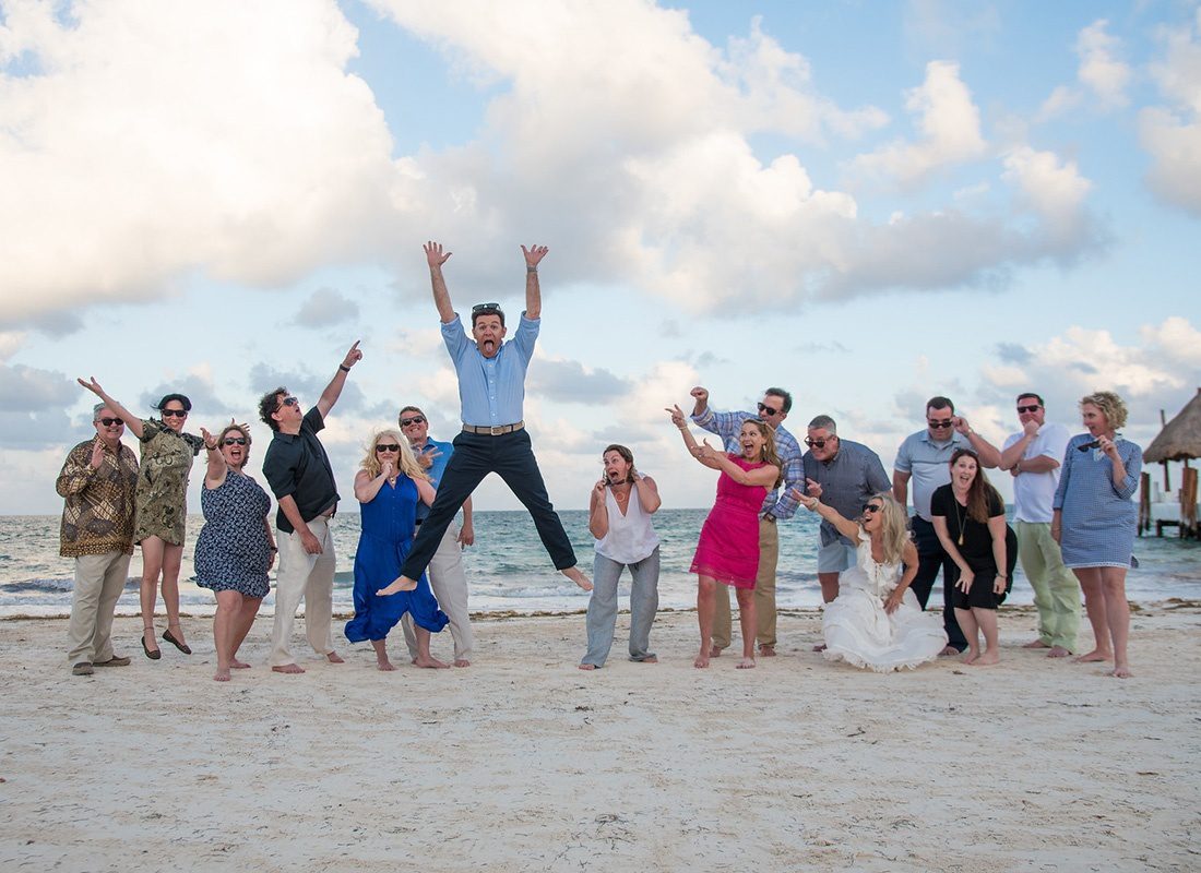 Careers - Southern States Insurance Team Standing on the Beach in Cancun and Having Fun Being Silly on a Mexico Reward Trip