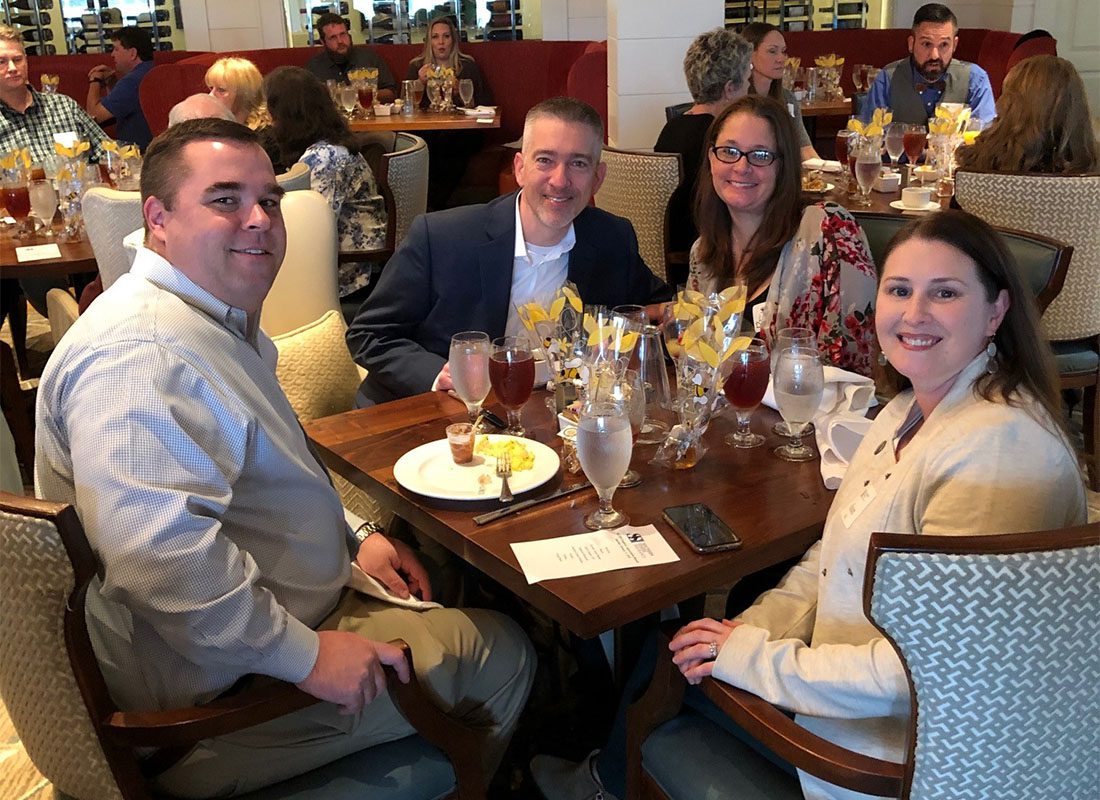 Personal Lines Agent - Group Photo of Jon Hall and Derek Dunham with Their Spouses at the Employee Appreciation Brunch