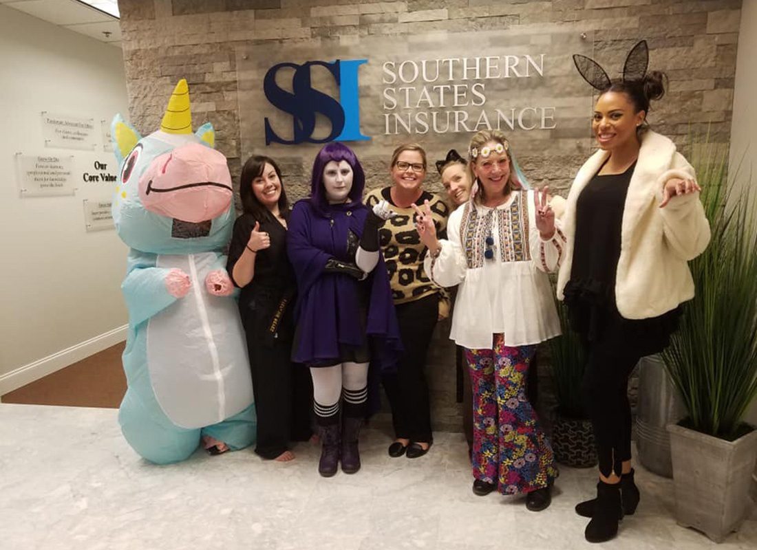 Personal Lines Processor - Group Photo of Ladies in the Southern States Insurance Team Dressed in Costumes for Halloween in the Office Lobby